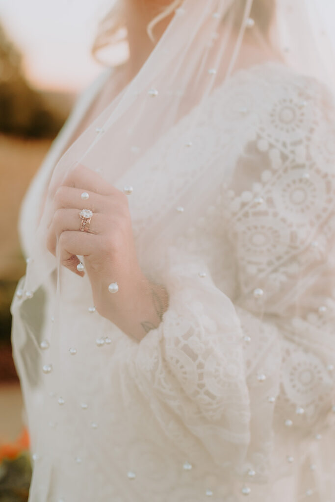 Bride in a flowing gown standing at Sacred Oak Vineyard, ideal for romantic outdoor wedding photography