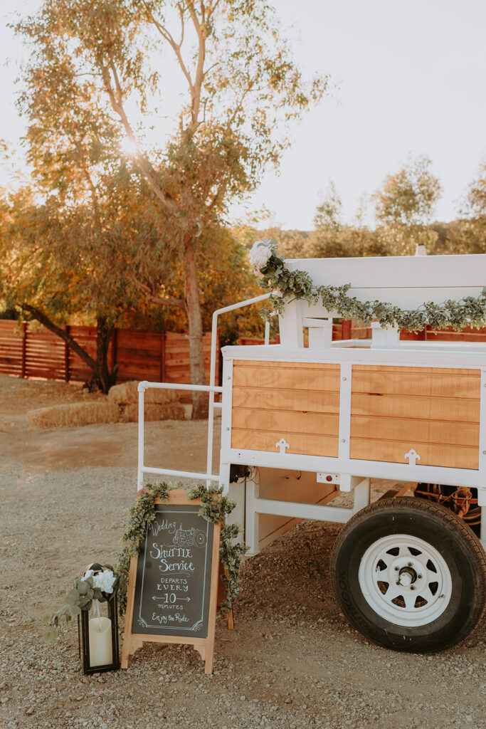Rustic wedding decor with wine barrels and floral arrangements at Sacred Oak Vineyard in Cherry Valley.