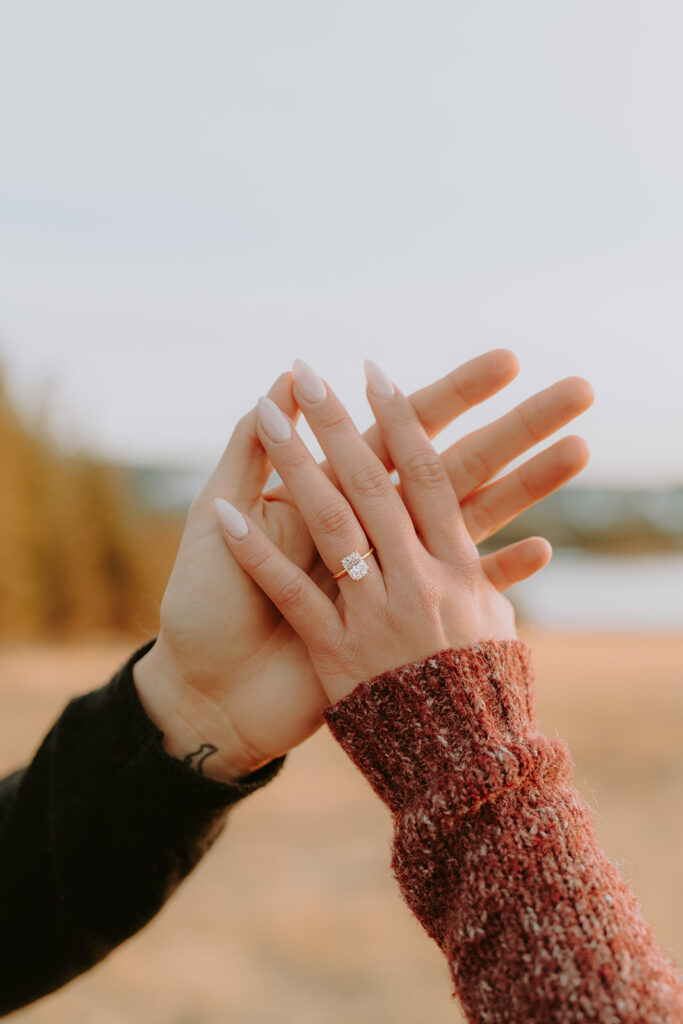 engagement ring on hands