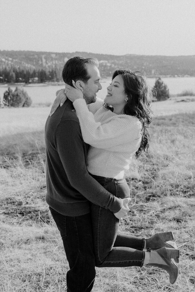 black and white of a man and women holding hands