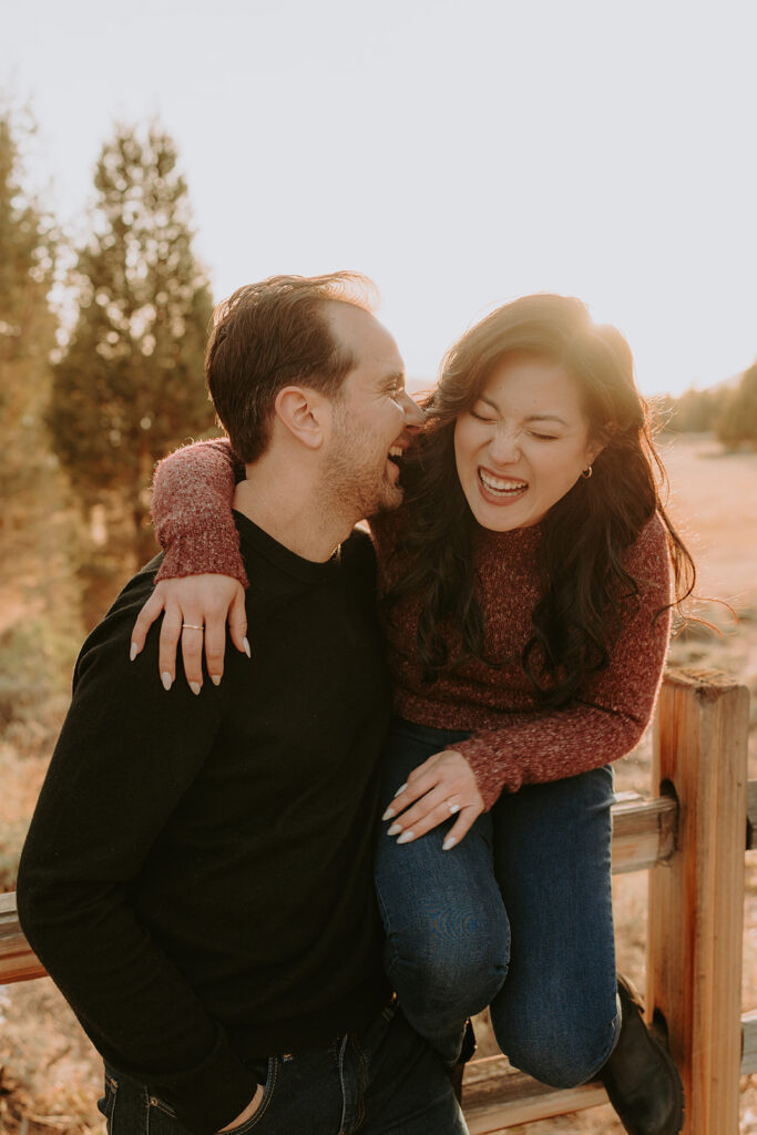 engaged couple laughing