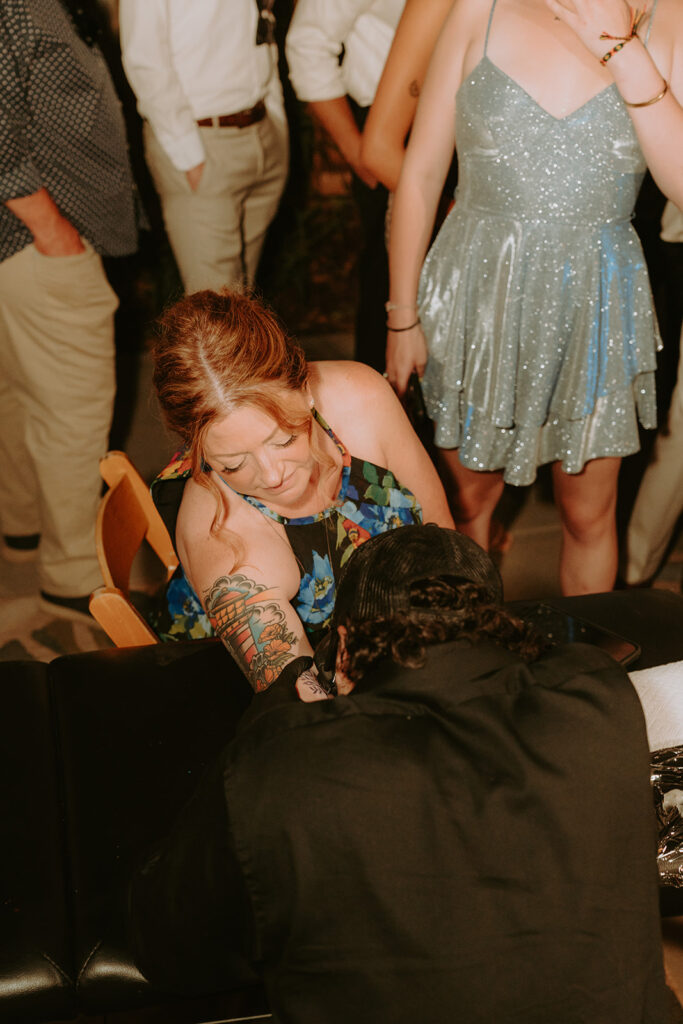 Orange Street Tattoo artists in action at wedding reception